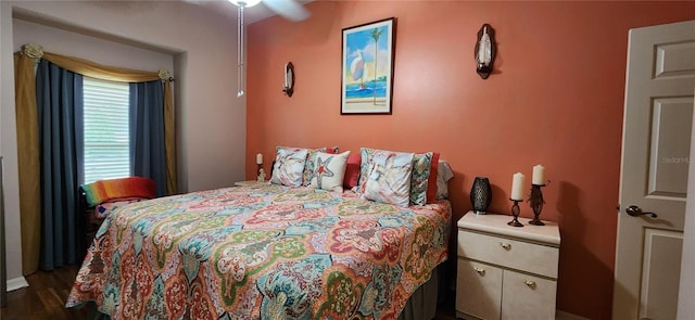 bedroom with dark wood-type flooring and ceiling fan