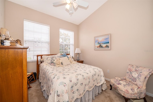 carpeted bedroom featuring ceiling fan, lofted ceiling, and multiple windows