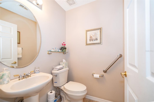 bathroom featuring sink and toilet