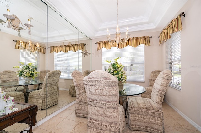 tiled dining area featuring a raised ceiling and crown molding