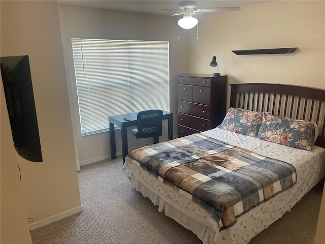 bedroom featuring light colored carpet and ceiling fan