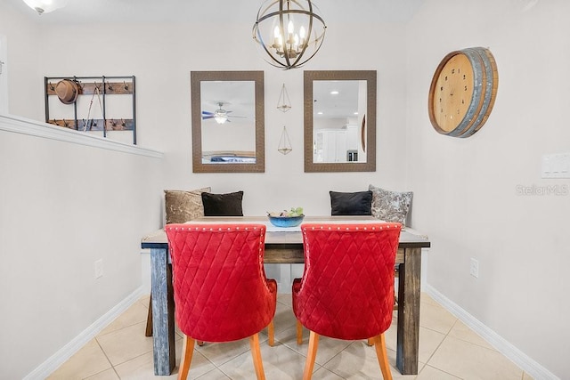 tiled dining room featuring ceiling fan with notable chandelier