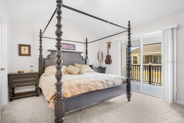 carpeted bedroom with access to exterior and vaulted ceiling