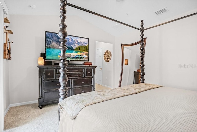 carpeted bedroom with vaulted ceiling