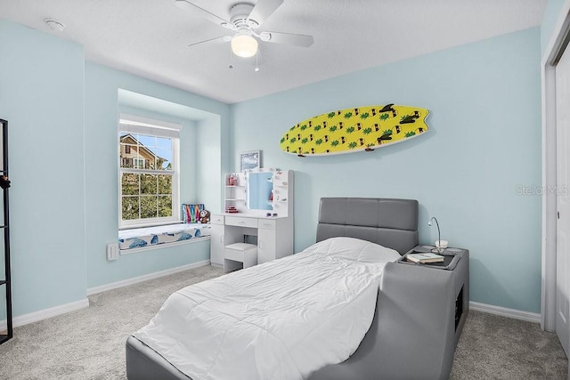 bedroom featuring ceiling fan and light colored carpet