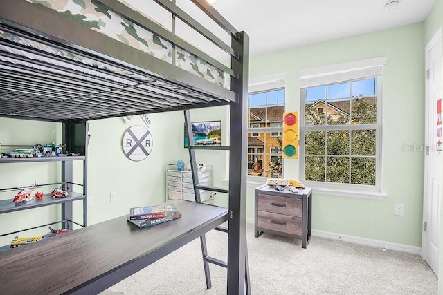 bedroom featuring light carpet