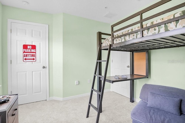 bedroom with light colored carpet