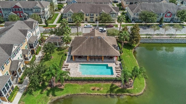 birds eye view of property with a water view