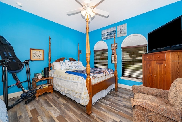 bedroom featuring dark hardwood / wood-style flooring and ceiling fan