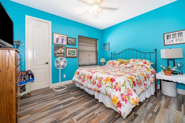 bedroom featuring ceiling fan and dark wood-type flooring