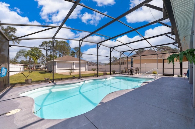 view of pool with a patio area, a lawn, and a lanai