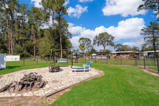 view of yard featuring a fire pit and a patio area