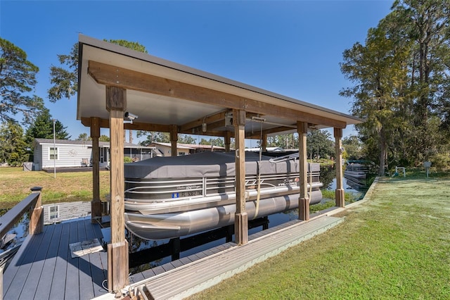 view of dock with a lawn