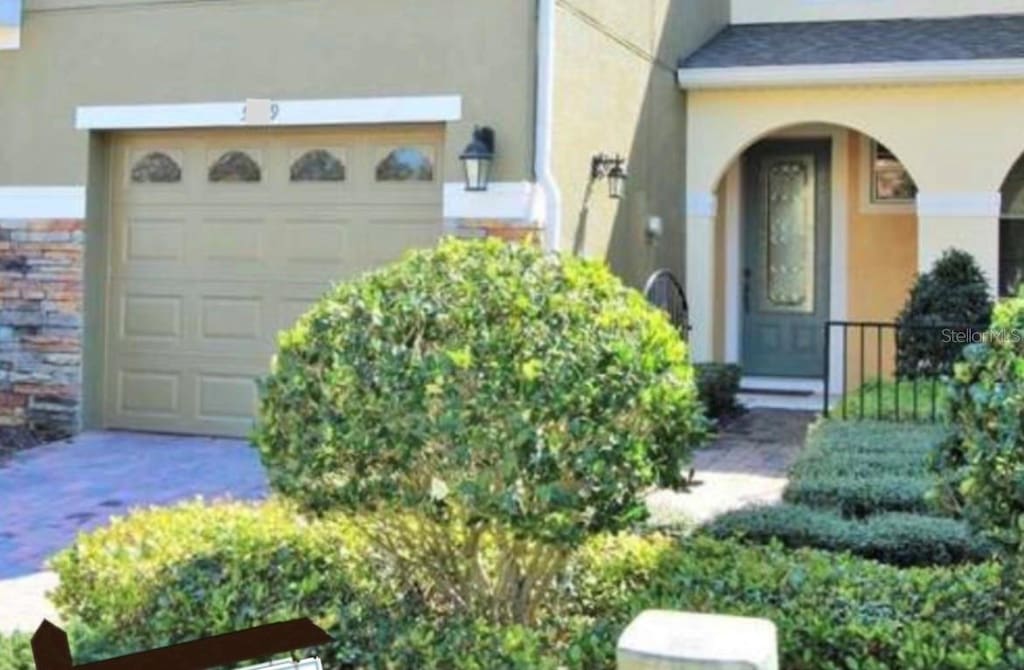 entrance to property featuring a garage