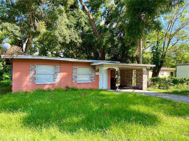 ranch-style house featuring a carport