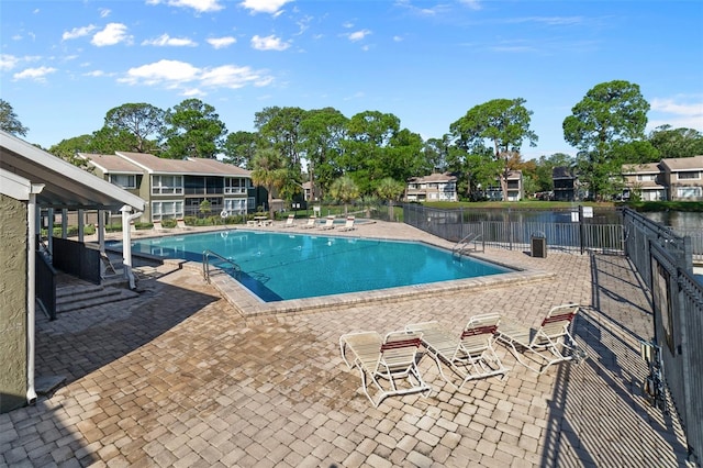 view of swimming pool with a patio