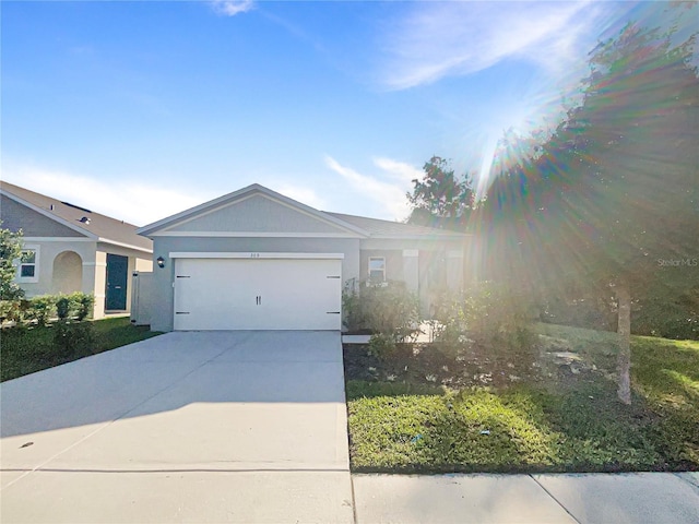 309 Gina Ln, Davenport, FL 33837 - single story home with an attached garage and concrete driveway