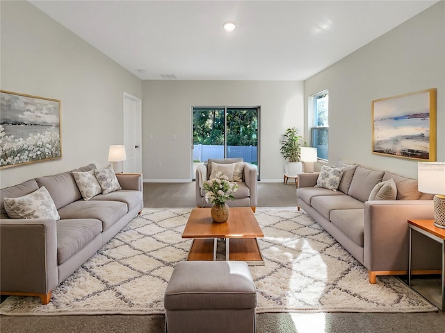 309 Gina Ln, Davenport, FL 33837 - carpeted living room with baseboards and recessed lighting