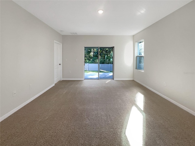 unfurnished room with carpet flooring