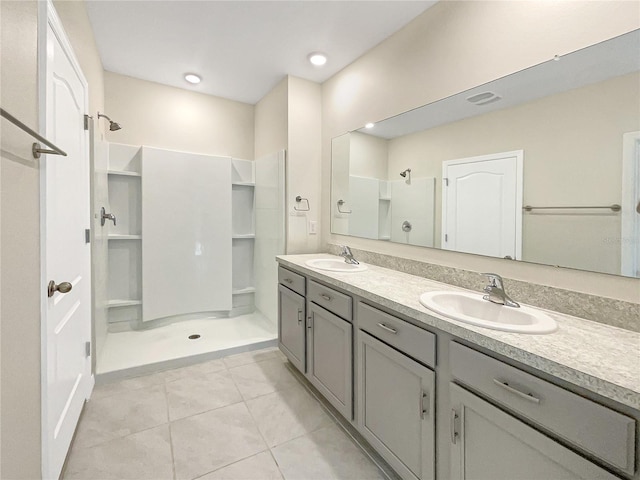 309 Gina Ln, Davenport, FL 33837 - bathroom featuring a shower stall, tile patterned floors, and double vanity