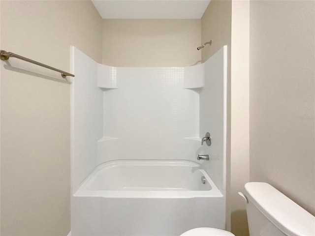 bathroom with toilet and shower / bathtub combination