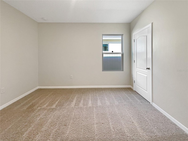 309 Gina Ln, Davenport, FL 33837 - carpeted spare room featuring baseboards