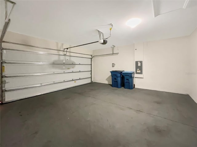 garage with electric panel and a garage door opener