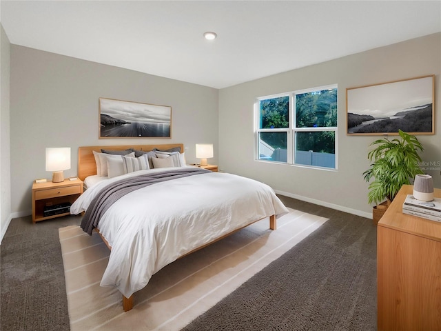 bedroom featuring dark carpet