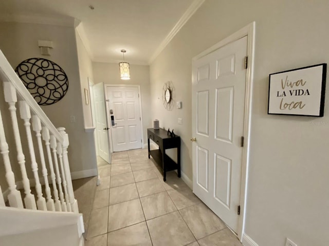 tiled foyer with crown molding