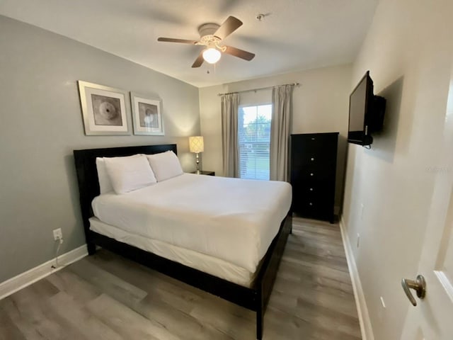 bedroom featuring hardwood / wood-style floors and ceiling fan