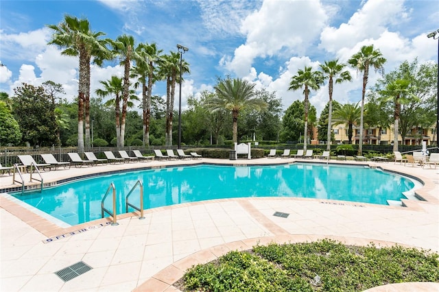 view of pool featuring a patio