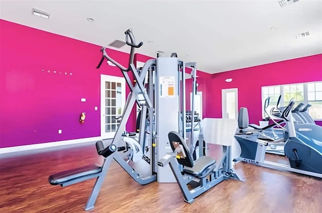 gym with hardwood / wood-style flooring