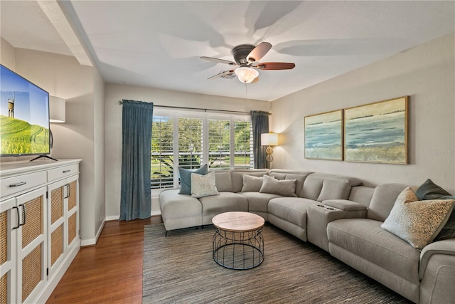 living room featuring dark hardwood / wood-style floors and ceiling fan