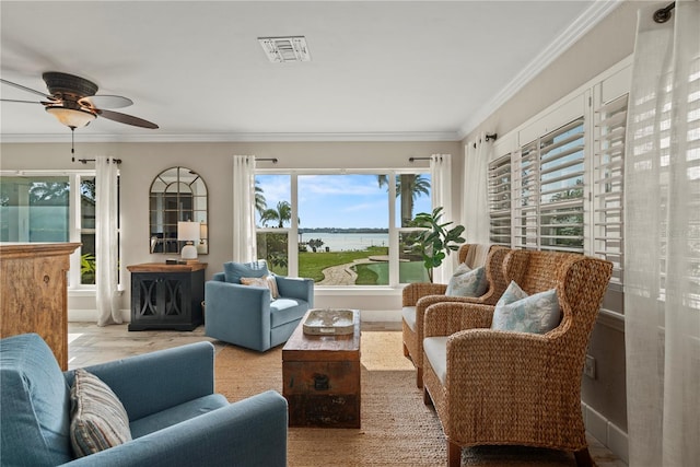 sunroom / solarium with a water view and ceiling fan