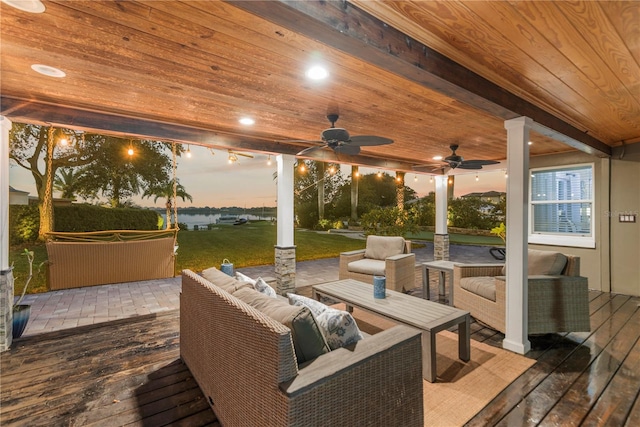 exterior space featuring an outdoor living space, a deck, and ceiling fan