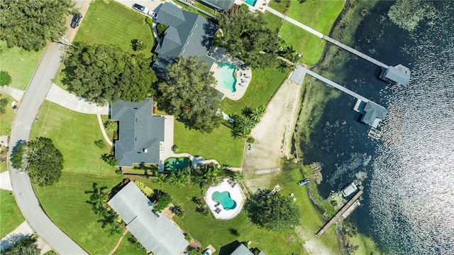 birds eye view of property with a water view