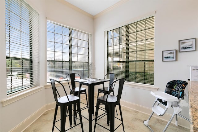 dining area with ornamental molding