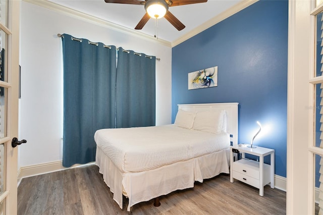 bedroom with ornamental molding, hardwood / wood-style flooring, and ceiling fan