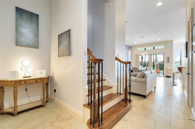 stairs featuring french doors and tile patterned floors