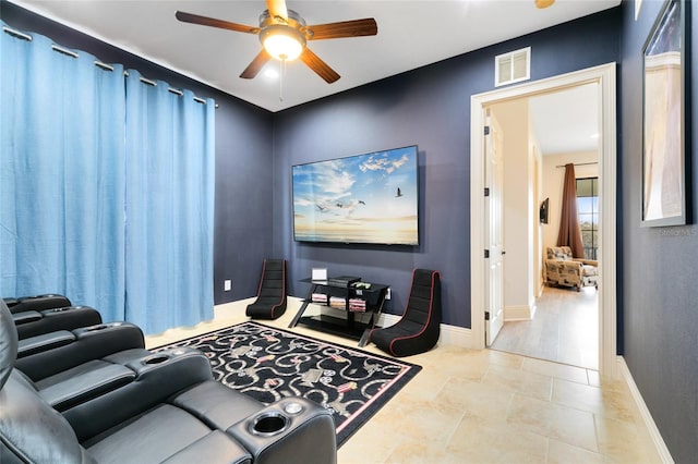 home theater featuring light hardwood / wood-style flooring and ceiling fan