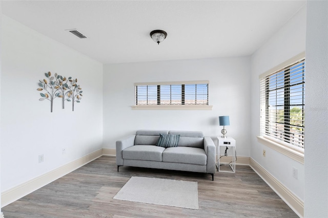 living area featuring hardwood / wood-style floors