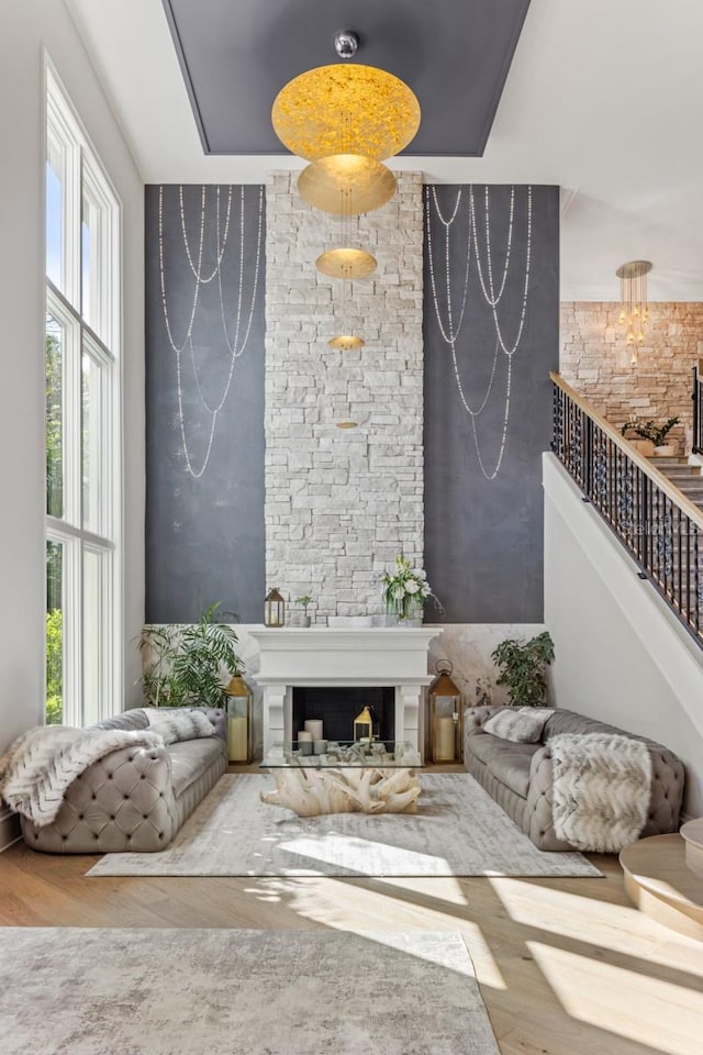 living room featuring a fireplace and wood-type flooring