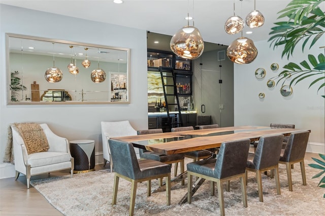 dining area with hardwood / wood-style floors