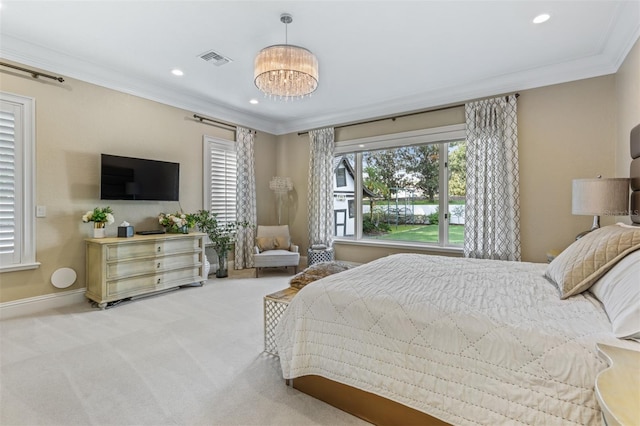 bedroom with crown molding, carpet, and an inviting chandelier