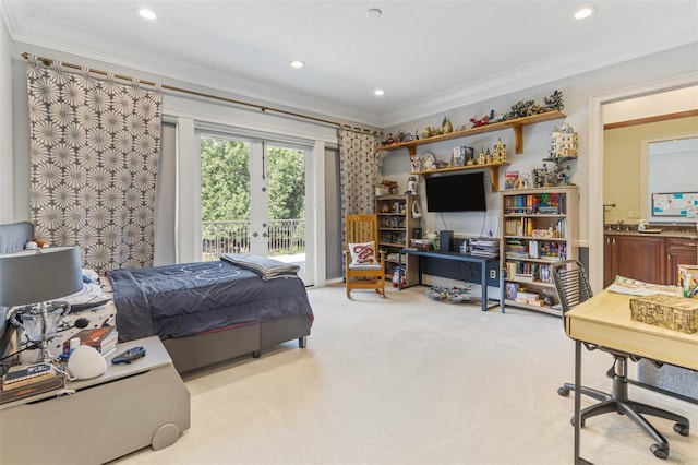 carpeted bedroom with access to outside, crown molding, french doors, and ensuite bathroom