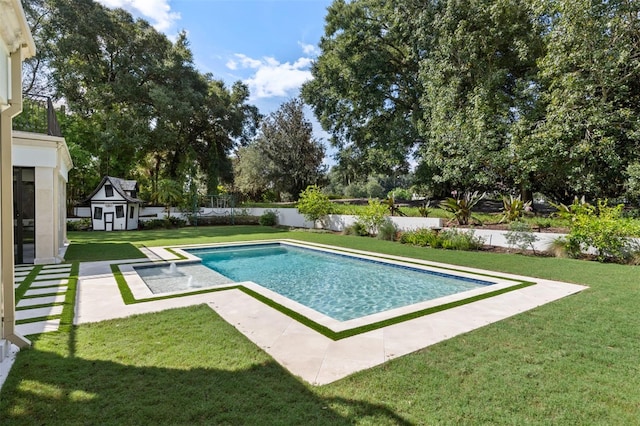 view of swimming pool with a patio, a storage unit, and a yard