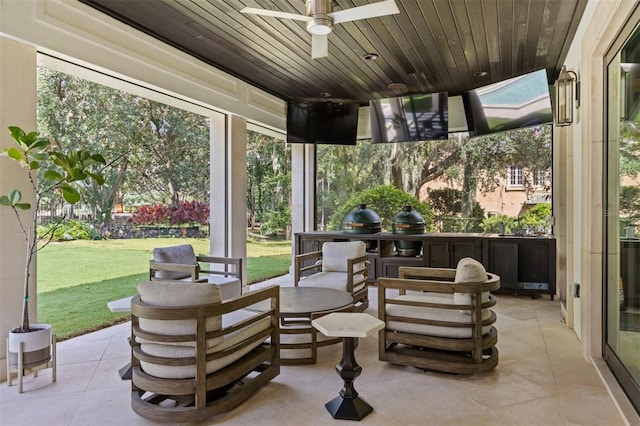 view of patio featuring ceiling fan