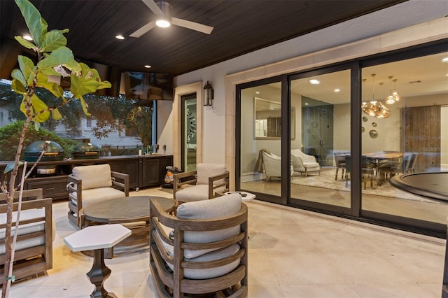 view of patio / terrace featuring ceiling fan