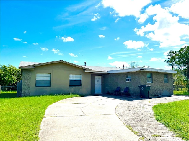 ranch-style house with a front lawn