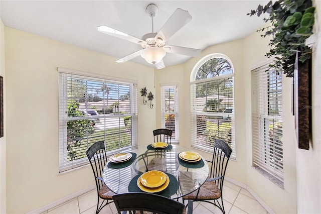 dining room with light tile patterned flooring, ceiling fan, and plenty of natural light